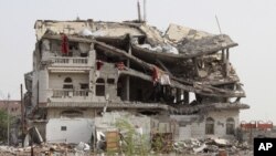 A view of a building destroyed by a Saudi-led air strike is seen in Haradh city of Yemen's northwestern province of Hajja May 20, 2015. 