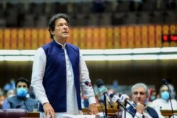 FILE - In this handout photo from Pakistan's Press Information Department taken June 25, 2020, Pakistan's Prime Minister Imran Khan speaks during a National Assembly session in Islamabad.