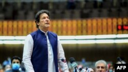 In this handout photograph released by the Pakistan's Press Information Department and taken on June 25, 2020, Pakistan's Prime Minister Imran Khan speaks during the National Assembly session in Islamabad.