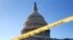 Police tape marks a secured area of the Capitol, Jan. 19, 2018, in Washington. 