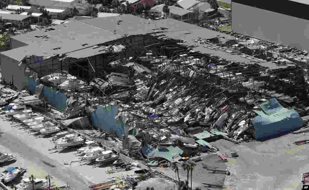 A roof of a boat storage building collapses following damage from Hurricane Michael in Panama City Beach, Florida.