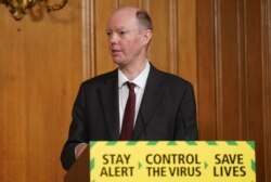 Britain's Chief Medical Officer for England Chris Whitty attends a remote press conference to update the nation on the COVID-19 pandemic, inside 10 Downing Street in central London on June 10, 2020.