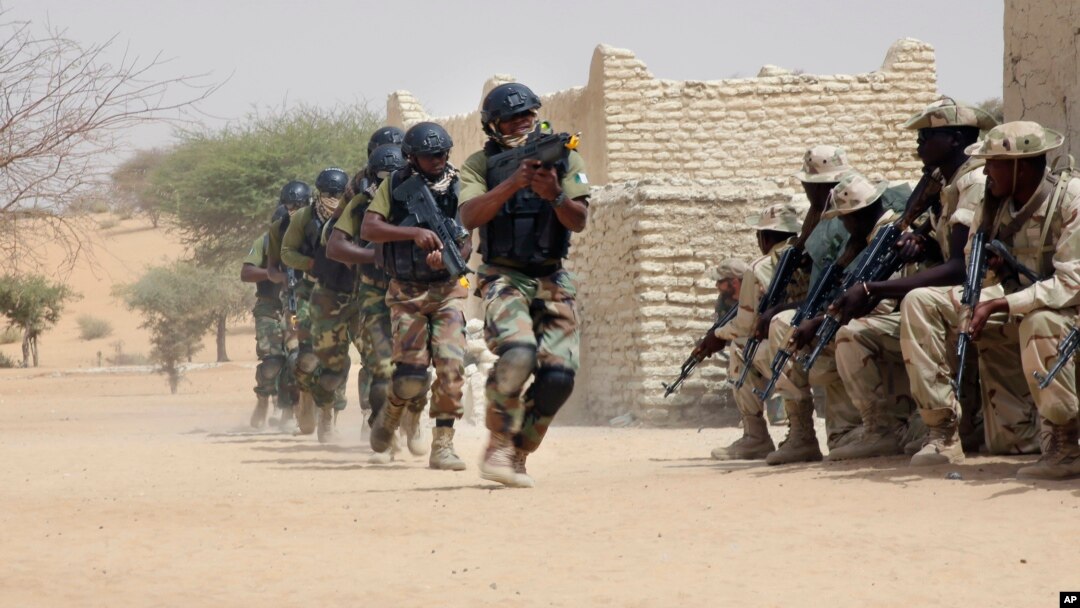 FILE - Nigerien special forces and Chadian troops participate with U.S. advisers in the Flintlock exercise in Mao, Chad, March 7, 2015.