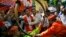 Supporters of India’s ruling Bharatiya Janata Party (BJP) celebrate as early results indicated the party leading in the Maharashtra state Assembly elections in Mumbai, India, Oct. 19, 2014. 