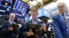 Traders work on the floor of the New York Stock Exchange in New York, Feb. 22, 2019.