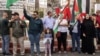 A young Palestinian girl holds up a portrait of slain Hamas leader Yahya Sinwar during a rally in Ramallah, in the occupied-West Bank on Oct. 18, 2024.