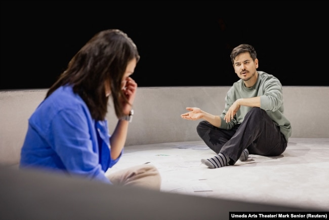 Actors Susan Momoko Hingley and Mark Takeshi Ota perform in the production of "One Small Step" in London, Britain, September 27, 2024. (Umeda Arts Theater/ Mark Senior/Handout via REUTERS)