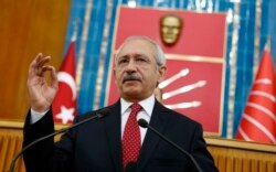 FILE - Turkey's main opposition Republican People's Party (CHP) leader Kemal Kilicdaroglu addresses his party MPs during a meeting at the Turkish parliament in Ankara, April 8, 2014.