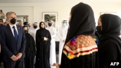 US Secretary of State Antony Blinken (L) and Qatar’s assistant Foreign Minister Lolwah al-Khater (3rd L) meet with Afghan all-female robotics team members at Qatar's Education City Club House in Doha on September 7, 2021.