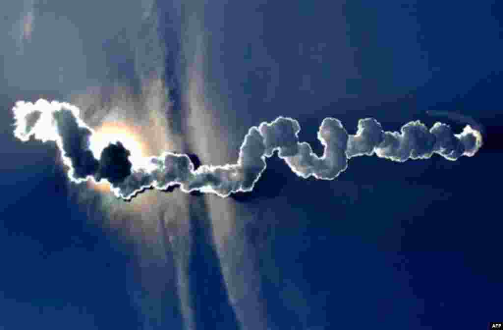 January 20: A Boeing Delta 4 Heavy rocket, which may someday be used to send humans into space, rises from the launch pad during its first unmanned launch at Vandenberg Air Force Base, Calif. (AP/Phil Klein)