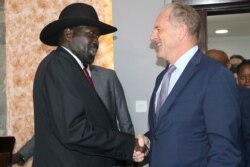 South Sudan's President Salva Kiir, left, shakes hands with U.N. special representative, David Shearer during meetings with the U.N. Security Council on Oct. 20, 2019.