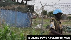 A U.N. peacekeeper stands guard at the U.N. Mission in South Sudan base in Malakal, where some 19,000 people have been sheltering in this 2014 file photo.