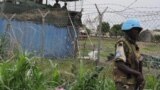 A U.N. peacekeeper stands guard at the U.N. Mission in South Sudan (UNMISS) base in Malakal. The U.N. wants to use drones and helicopters to protect civilians but South Sudan says there is no need for the equipment.