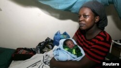 Josephine Ochieng holds her newborn baby boy at the Nyanza Provincial general, Kisumu, Kenya, November 2008.