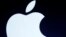 FILE - The Apple logo is projected during an announcement in San Francisco.