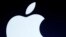 FILE - The Apple logo is projected during an announcement in San Francisco.