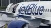 FILE PHOTO: Branding for JetBlue Airlines is seen at Farnborough International Airshow, in Farnborough