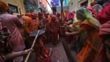 Women participate in the Lathmar holi at Nandgoan village, 115 kilometers (70 miles) south of New Delhi, India, March 9, 2025.