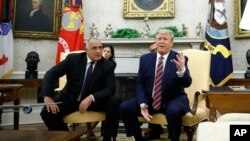 President Donald Trump speaks with members of the press as he meets with Bulgarian Prime Minister Boyko Borissov in the Oval Office of the White House, Nov. 25, 2019, in Washington.