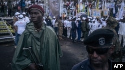 Military and police officers stand guard at the incumbent president President Felix Tshisekedi's campaign rally in Goma, capital of North Kivu province, eastern Democratic Republic of Congo, on December 10, 2023.