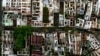 FILE - Homes stand abandoned due to ground subsidence caused by the Braskem mine in Maceio, Alagoas state, Brazil, March 6, 2022. 