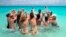 Tourists exercise in the water in the Santa Maria Key Resort in central Cuba, April 4, 2013.