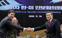 U.S. Defense Secretary Mark Esper and South Korean Defense Minister Jeong Kyeong-doo shake hands for the media before the 51st Security Consultative Meeting at the Defense Ministry in Seoul, South Korea, Nov. 15, 2019.