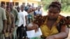 A woman casts her vote in a ballot box n empty ballot box at Agulu in Anambra State on February 6, 2010.