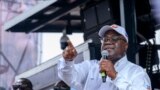 (FILES) President of the Democratic Republic of the Congo (DRC) and leader of the Union of Democracy and Social Progress (UDPS) party, Felix Tshisekedi (R), speaks to supporters during a campaign rally at Sainte Therese in the Ndjili district of Kinshasa 