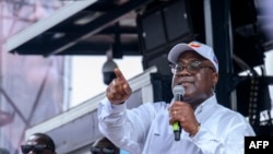 FILE - President of the Democratic Republic of the Congo (DRC) and leader of the Union of Democracy and Social Progress (UDPS) party, Felix Tshisekedi, speaks to supporters during a campaign rally at Sainte Therese in the Ndjili district of Kinshasa on December 18, 2023. 