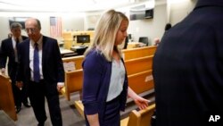 Fired Dallas police officer Amber Guyger leaves the courtroom after a jury finds her guilty of murder of Botham Jean, in Dallas, Texas, Oct. 1, 2019.