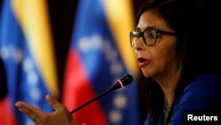 FILE - Delcy Rodriguez, president of the National Constituent Assembly talks to the media during a news conference in Caracas, Venezuela, Aug. 28, 2017.