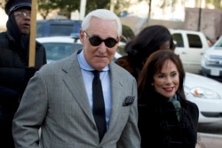 FILE - Roger Stone, former campaign adviser to U.S. President Donald Trump, arrives for the continuation of his trial on charges of lying to Congress, obstructing justice and witness tampering, at U.S. District Court in Washington, Nov. 15, 2019.