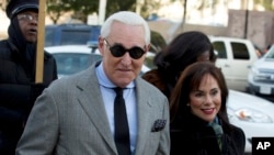 Roger Stone, accompanied by his wife Nydia Stone, arrives at federal court in Washington, Nov. 14, 2019.