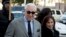 Roger Stone, accompanied by his wife Nydia Stone, arrives at federal court in Washington, Nov. 14, 2019.