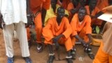 FILE - This undated photo shows prisoners sitting together at the central prison in Juba, South Sudan.