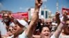 FILE - Supporters of Turkey's Republican People's Party protest outside a court in Istanbul, where CHP Istanbul provincial chairwoman Canan Kaftancioglu appeared, July 18, 2019. Kaftancioglu is standing trial for tweets she posted on social media.