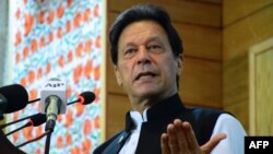 FILE - Pakistan's Prime Minister Imran Khan addresses the legislative assembly in Muzaffarabad, the capital of Pakistan-controlled Kashmir, Aug. 5, 2020.