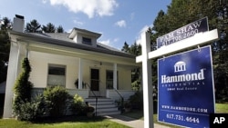 This September 19, 2011 photo, shows a home for sale in Newton, Massachusetts.