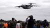 FILE - China's Y-20 transport aircraft flies at the 2024 Africa Aerospace and Defence Exhibition at Waterkloof Air Force Base in Pretoria, South Africa, Sept. 22, 2024. 