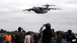 FILE - China's Y-20 transport aircraft flies at the 2024 Africa Aerospace and Defence Exhibition at Waterkloof Air Force Base in Pretoria, South Africa, Sept. 22, 2024. 