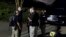 Agents with the Bureau of Alcohol, Tobacco, Firearms and Explosives leave the family home, in Baltimore, Aug. 26, 2018, of the suspect in a mass shooting earlier in the day in Jacksonville, Florida.