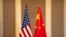 FILE — Undated photo of flags of the U.S. and China. An international military forum in China next week is expected to provide an opportunity for military-to-military contact between the U.S. and China.