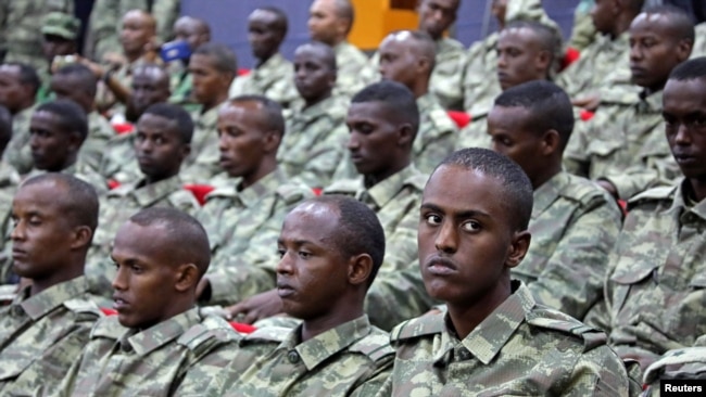 FILE - Somali soldiers attend a ceremony in Mogadishu, Somalia, Sept. 30, 2017.