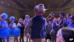 Callum Ganz, 17, center, gives a pre-show pep talk to castmates in 'Crazy for You' on opening night as the Theatre Palisades Youth group returns to the stage after losing their theater in the Palisades fire, in Los Angeles, Feb. 28, 2025.