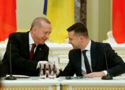 Ukrainian President Volodymyr Zelenskiy, right, and Turkey's President Recep Tayyip Erdogan attend a joint news conference following their talks in Kyiv, Ukraine, Feb. 3, 2020.