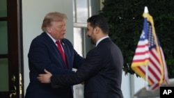 President Donald Trump greets Iraq's Prime Minister Ali al-Zaidi at the White House, Tuesday, July 14, 2026, in Washington. (AP Photo/Julia Demaree Nikhinson)
