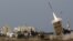 An Iron Dome launcher fires an interceptor rocket in the southern city of Ashdod, Israel, November 16, 2012. 