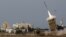 An Iron Dome launcher fires an interceptor rocket in the southern city of Ashdod, Israel, November 16, 2012. 