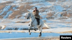 North Korean leader Kim Jong Un rides a horse during snowfall in Mount Paektu in this image released by North Korea's Korean Central News Agency (KCNA) on October 16, 2019.